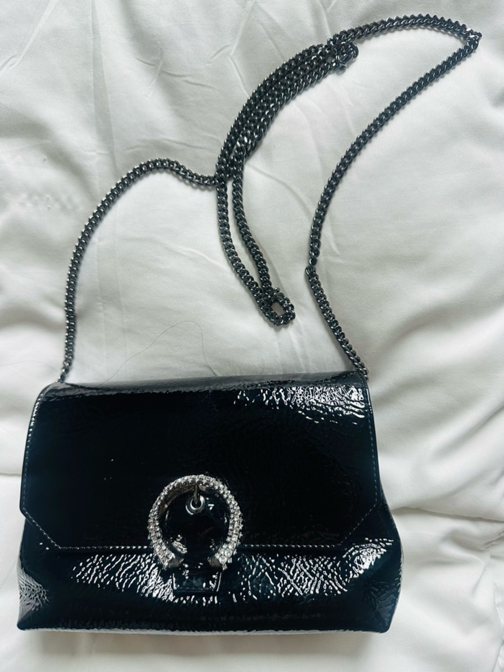 Jimmy Choo Black Patent Leather Clutch with Crystal Ring accent.